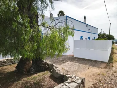 a bathroom with a shower with a toilet in it at Quinta do Medronhal Faro - casas de férias medronhal in Faro