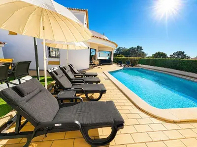 a swimming pool in front of a villa at Villa Cristina 17 - 500 m from the Beach in Albufeira