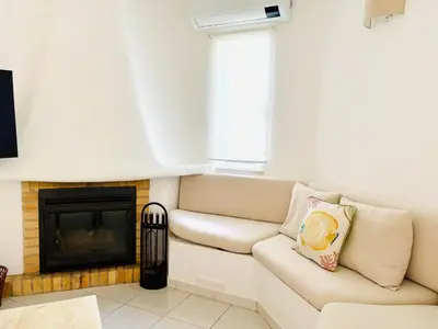 a white couch with a pillow on it at Casa da Balaia - beach, pool, golf and tennis in Albufeira