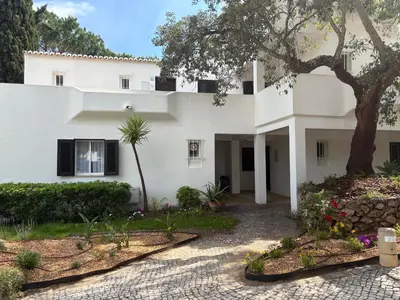 a white table and chairs in a room at Casa da Balaia - beach, pool, golf and tennis in Albufeira