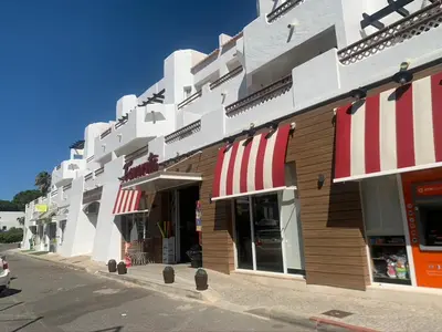 a white house with a gravel driveway at Casa da Balaia - beach, pool, golf and tennis in Albufeira