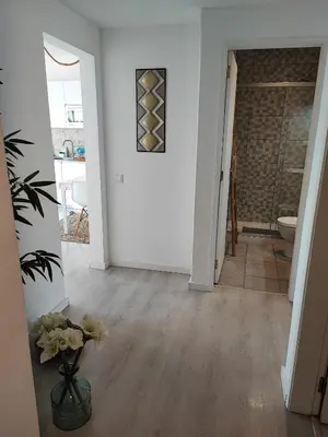 a hallway of a home with white walls at Milu house in Faro