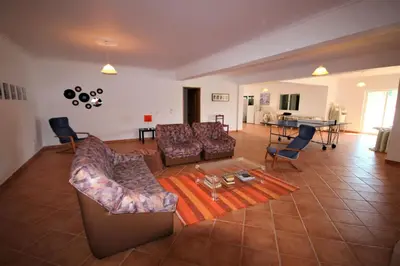 a large living room with couches and a table at Villa Olive in Loulé