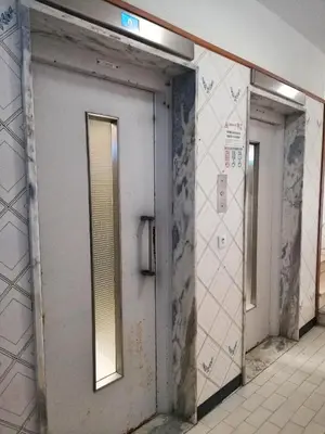 a row of doors in a bathroom with tiles at Mira Praia, Sunny and Sea in Quarteira