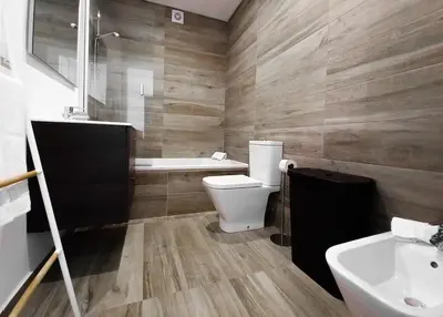 a bathroom with a toilet and a tub and a sink at Alto do Forte Novo- Ar- Condicionado, Wifi, Vista Mar in Quarteira