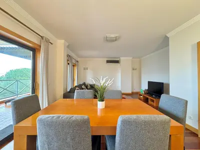 a dining room with a table and chairs at Albufeira Modern 1 with pool by Homing in Albufeira