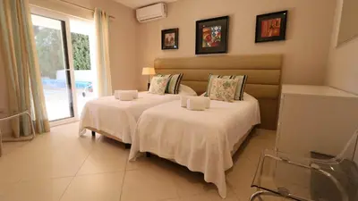 an overhead view of a swimming pool with chairs and a table at Beautiful Portuguese Villa Casa Das Buganvillas 3 Bedrooms Close To Praca in Vale do Lobo