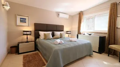 a white bathroom with a tub and a sink at Beautiful Portuguese Villa Casa Das Buganvillas 3 Bedrooms Close To Praca in Vale do Lobo
