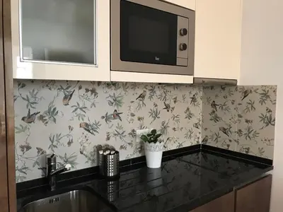 a kitchen with a sink and a microwave at Apartament near the ocean in Albufeira