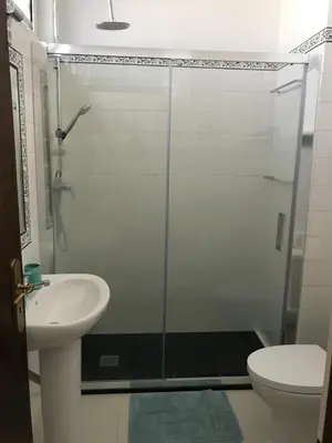 a bathroom with a shower and a sink and a toilet at Apartament near the ocean in Albufeira