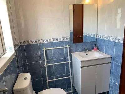a bathroom with a toilet and a sink at Apartamento 806 in Albufeira