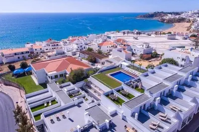 an aerial view of a house and the ocean at 