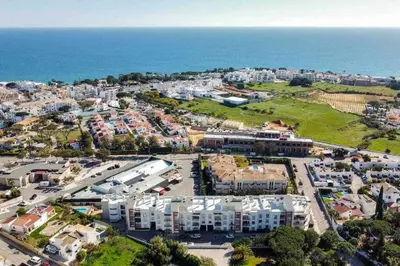 an aerial view of a parking lot next to the ocean at Medronheira B2 - Dream Lodging in Albufeira
