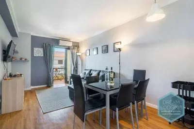 a dining room and living room with a table and chairs at Forte 303 - Dream Lodging in Albufeira