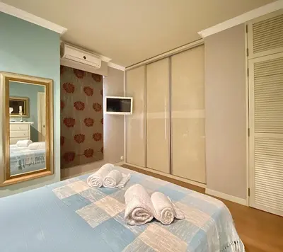 a bedroom with a bed with towels on it at Tália X - Near the beach - Vilamoura in Vilamoura