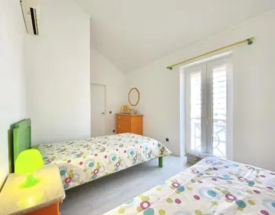 a bedroom with two beds and a window at Sunset Marina - Sea view - Vilamoura in Vilamoura