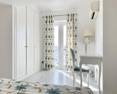 a bedroom with a bed and a desk and a window at Sunset Marina - Sea view - Vilamoura in Vilamoura