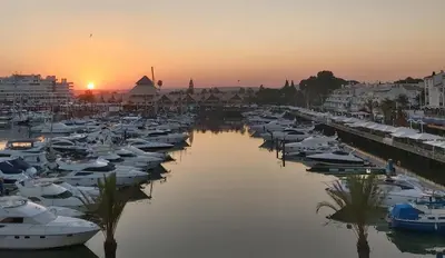 a group of boats docked in a marina at sunset at Sunset Marina - Sea view - Vilamoura in Vilamoura