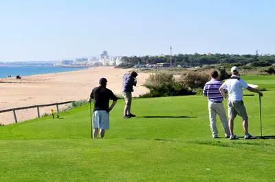 a group of people playing golf on the beach at Villa Varandas Do Lago 5 Bedroom Villa Private Pool Table Tennis in Vale do Lobo