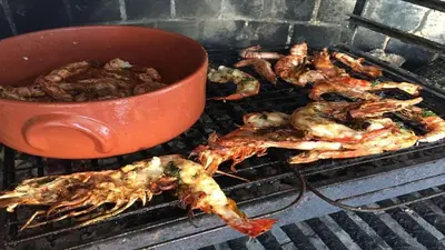 a bunch of food on a grill with a pot at Villa Vale Do Lobo 409 Beautiful 5 Bedrooms Heated Pool Short Walk in Vale do Lobo