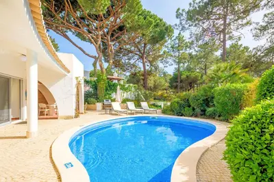 a swimming pool in the backyard of a house at Charming Vale Do Lobo Villa Private Pool Villa Vale Do Garro 51 in Vale do Lobo