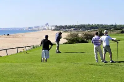 a group of people playing golf on the beach at Vale Do Lobo Villa 4 Bedrooms Villa Vale Do Lobo 186 Swimming Pool in Vale do Lobo