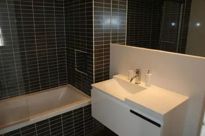 a bathroom with a sink and a bath tub at Vale Do Lobo Villa 4 Bedrooms Villa Vale Do Lobo 186 Swimming Pool in Vale do Lobo