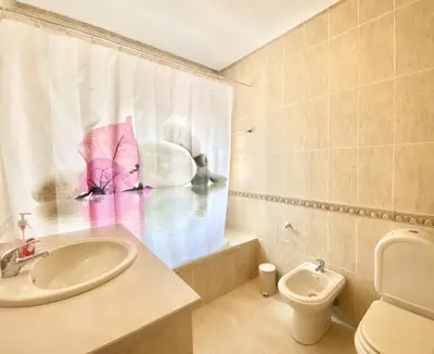 a bathroom with a sink and a toilet at Vila Pereira - Private Pool - Vilamoura in Vilamoura
