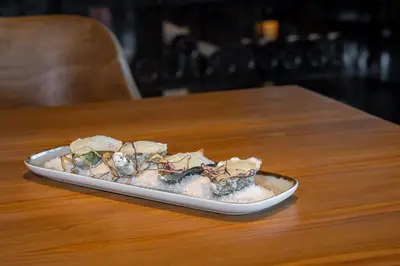 a plate of food sitting on top of a table at 3HB Faro in Faro