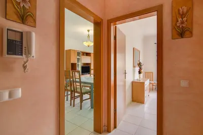 a hallway with a door leading to a dining room at Bosque São José Ag in Olhos de Água