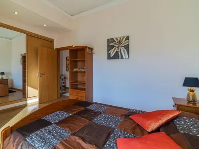 a bedroom with a large bed in a room at Holiday Home Bela Vitta by Interhome in Ferreiras