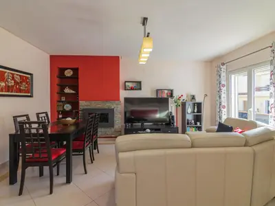 a living room with a couch and a dining room at Holiday Home Bela Vitta by Interhome in Ferreiras