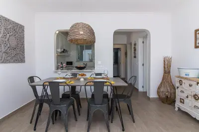 a living room with a couch and a table at Blue Apartment Balaia Space - By Dalma Portuguesa in Albufeira