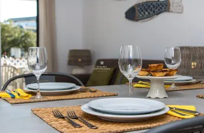a dining room with a table and chairs at Blue Apartment Balaia Space - By Dalma Portuguesa in Albufeira