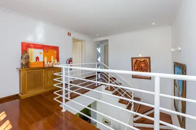 a staircase in a home with white railings at Villa Cecília in Albufeira