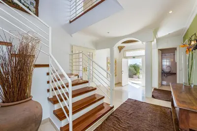 a staircase in a home with a vase at Villa Cecília in Albufeira