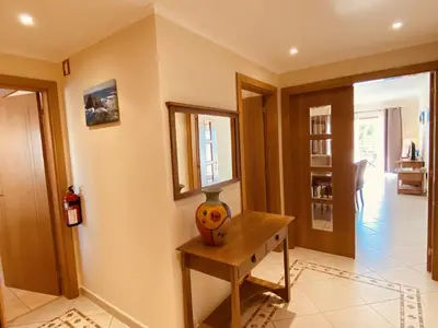 a room with a table with a vase on it at Vista by Check-in Portugal in Albufeira