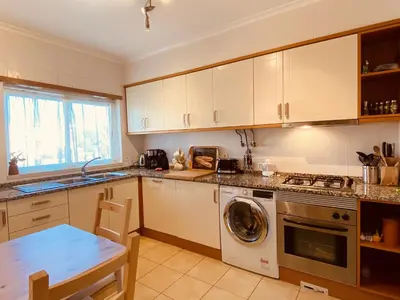 a kitchen with white cabinets and a dishwasher at Vista by Check-in Portugal in Albufeira