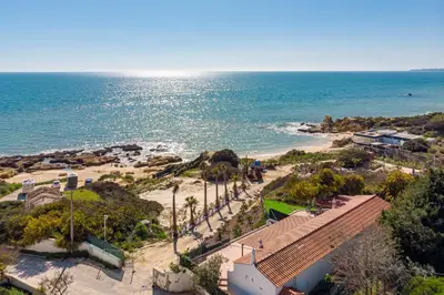 an aerial view of a beach and the ocean at Casa Mimao in Albufeira