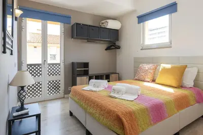 a bedroom with a bed with two towels on it at Marina Pearl - View to Vilamoura Marina in Vilamoura