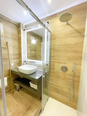a bathroom with a sink and a shower at Apartamentos SweetHomes in Faro