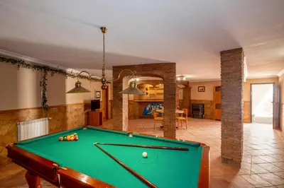 a pool table in the middle of a living room at Villa Samoa by Algarve Vacation in Albufeira