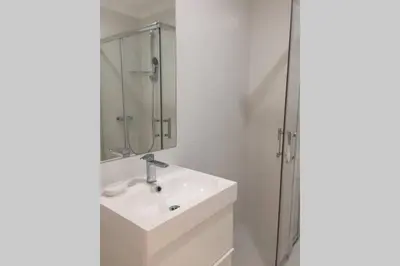 a bathroom with a sink and a shower at Marina Mar in Vilamoura downtown in Quarteira