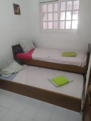 two bunk beds in a room with a window at Rêve au Soleil in Albufeira