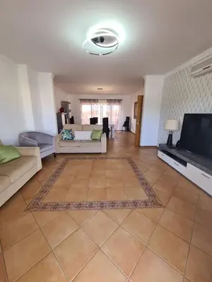 a living room with a couch and a flat screen tv at Vilamoura, Marina Sol T2 in Vilamoura