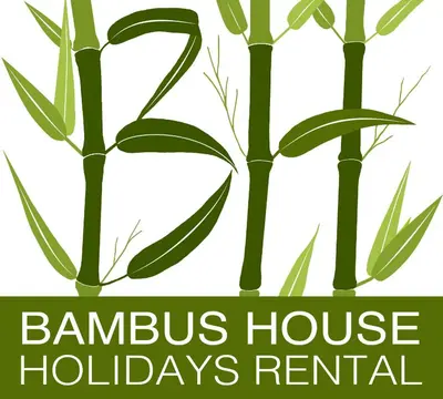 a logo for a bamboo house holidays rental at Bambus House Green in Quarteira