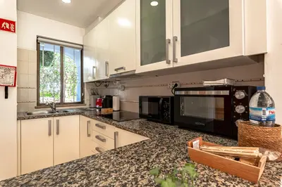 a bathroom with a washing machine and a shower at Seacoast Retreat with Pool and Beach Access by Drago Rentals in Albufeira