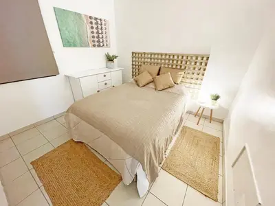 a bedroom with a bed in a small room at Beachfront Oura - 100m Beach, Seaview, Garage, 300m Strip in Albufeira