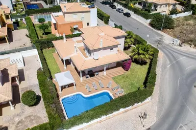 an aerial view of a house with a swimming pool at Villa Tulipa in Albufeira