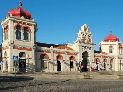 a large building with a tower and a clock at Villa Villa Rosa by Interhome in Loulé